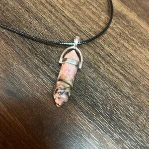 Rhodonite pendant. With black rope. Crystal. Gem. Heart